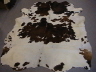 007 Dark Brown and White Cowhide Rug �325