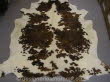 010 Brown and White Cowhide Rug